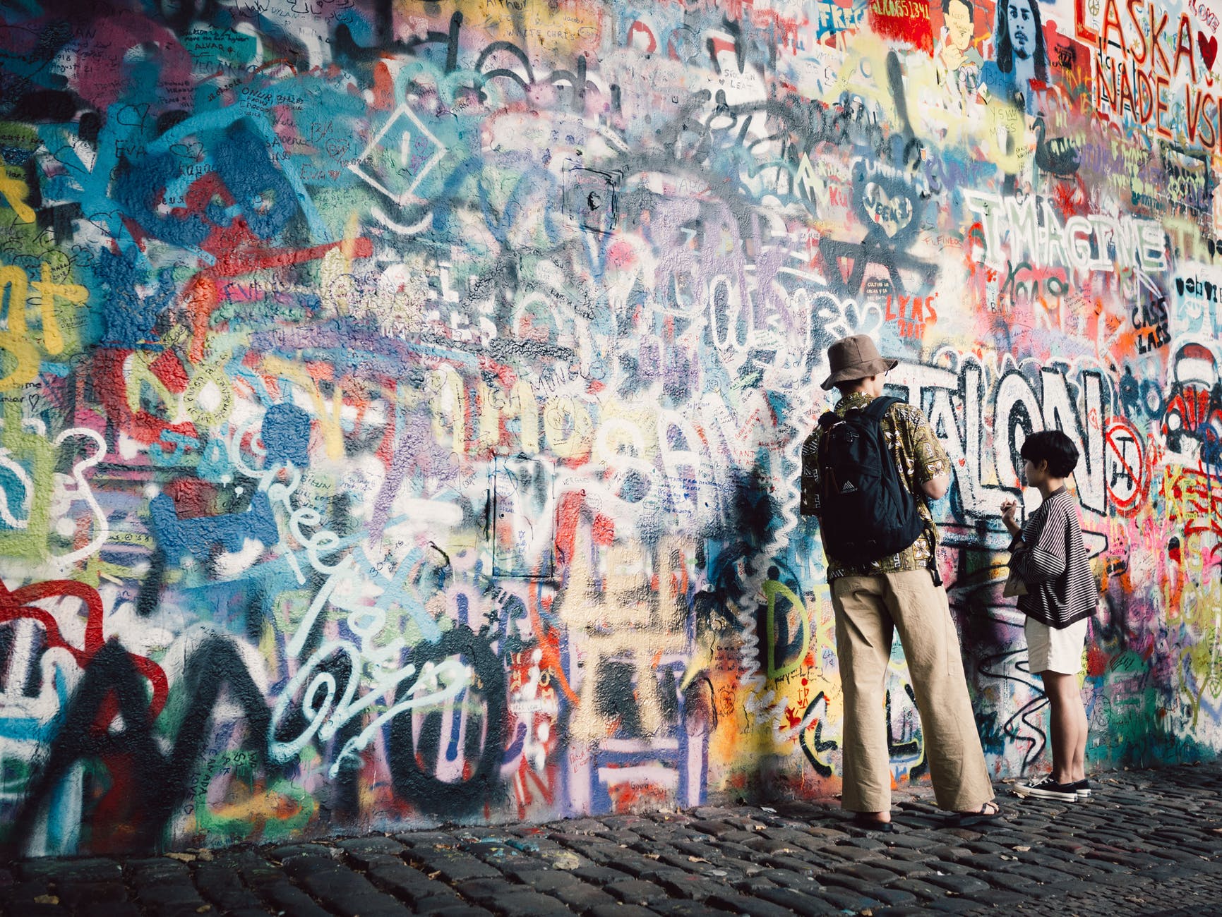 man and boy painting the wall